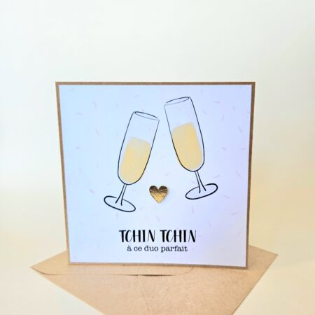Carte de mariage avec deux flûtes de champagne qui trinquent et le message "Tchin tchin à ce duo parfait".