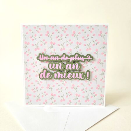 Carte d’anniversaire fleurie avec message "Un an de mieux !" en relief.