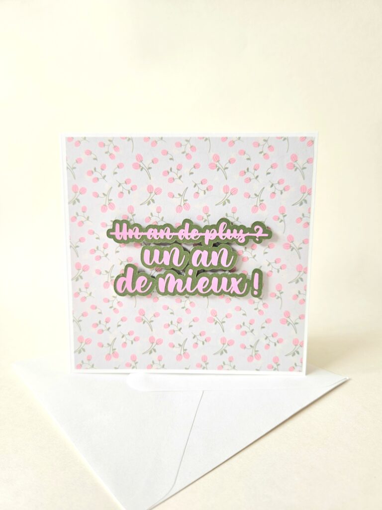 Carte d’anniversaire fleurie avec message "Un an de mieux !" en relief.