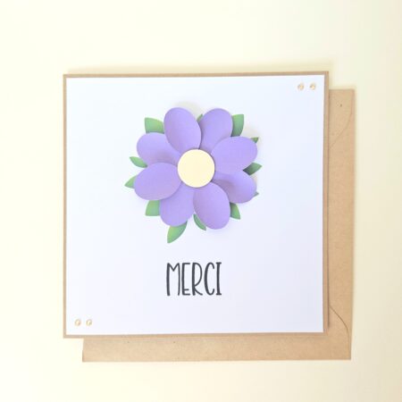 Carte de remerciement artisanale avec fleur violette en relief et message "Merci".