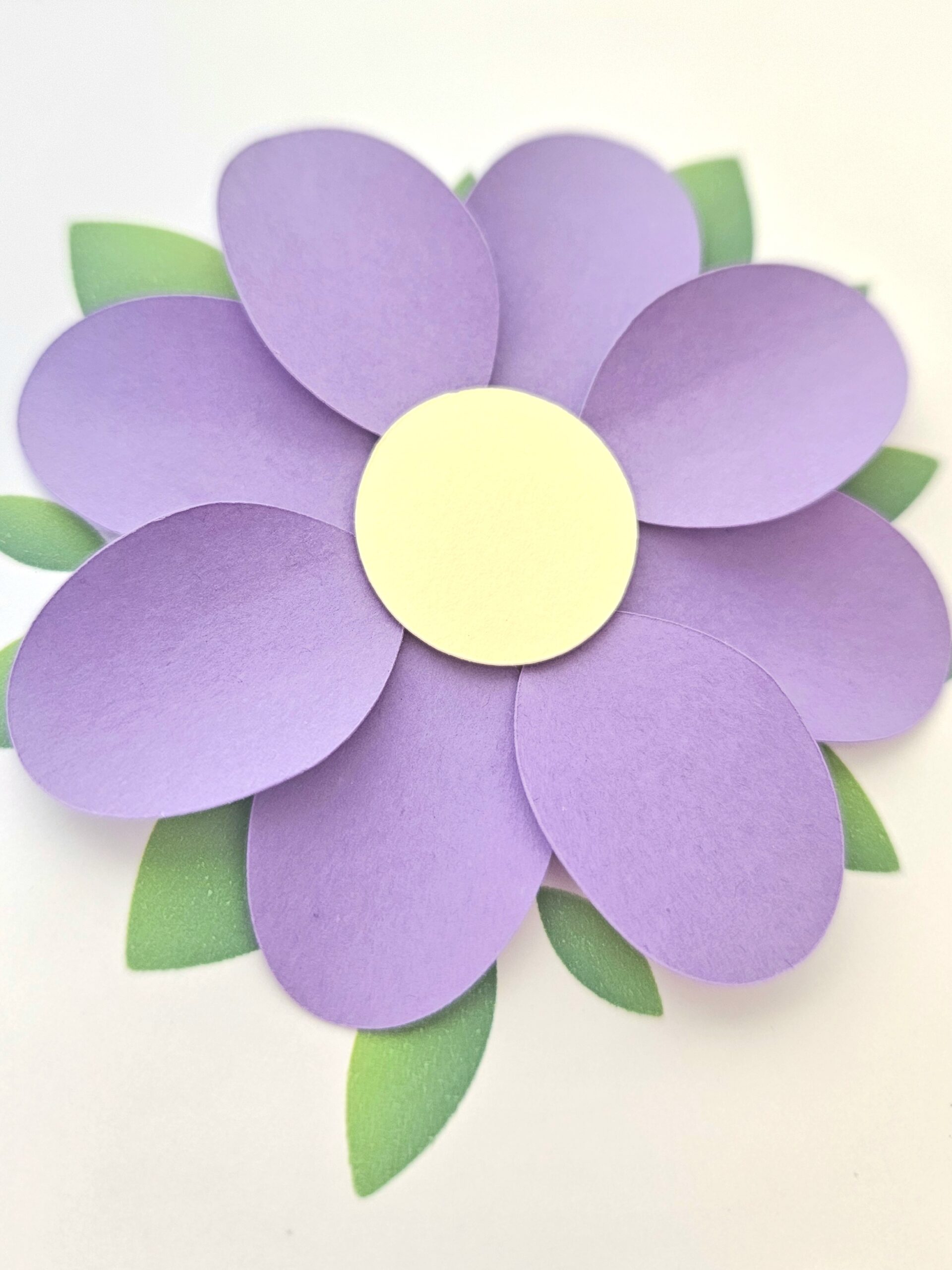 Carte de remerciement artisanale avec fleur violette en relief et message "Merci".